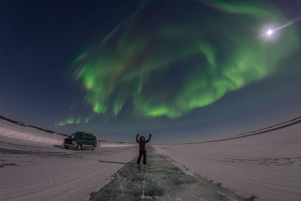 Photo of Melissa F. Kaelin under the Aurora in Northwest Territories taken by Cristiano Saturno.