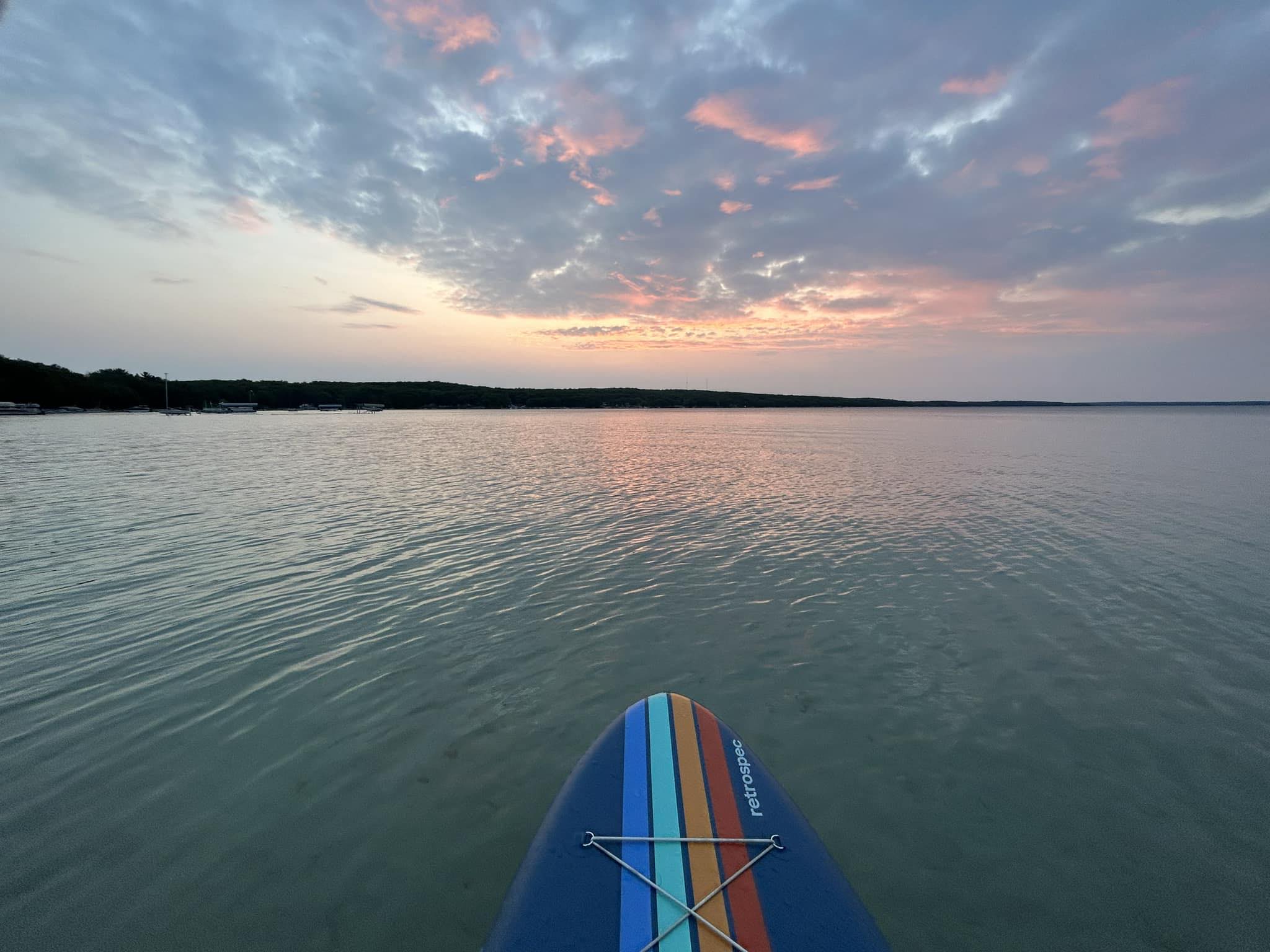 Photo of a paddleboard at sunset